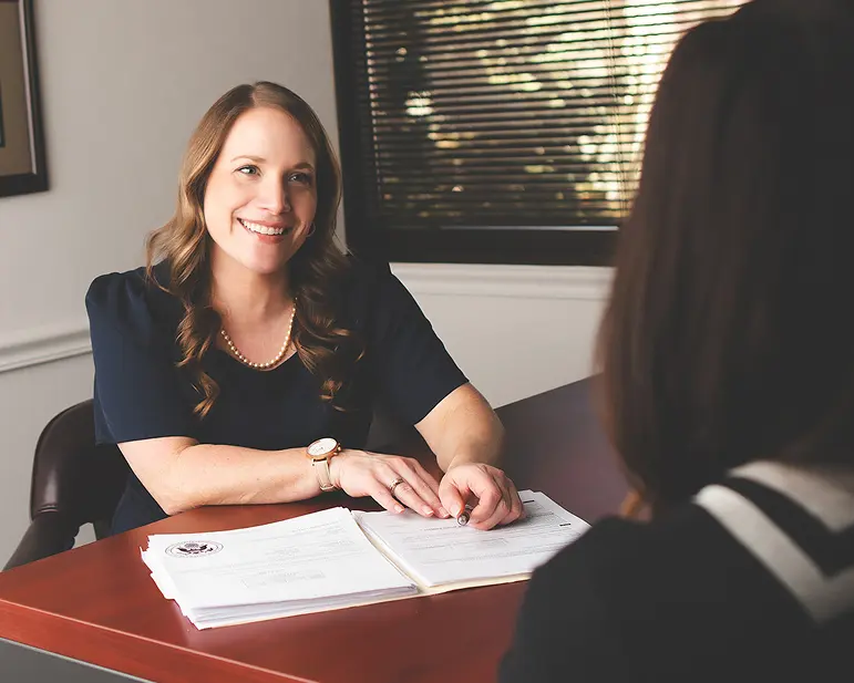 Danielle Weinzimmer speaks with a client