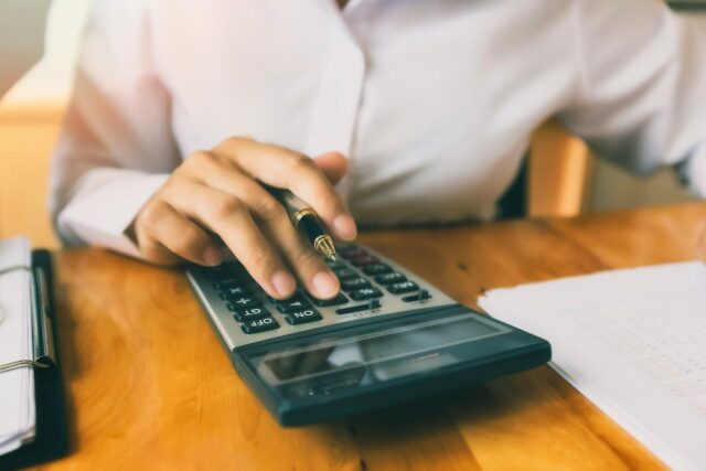 person using calculator