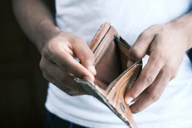 person holding open wallet